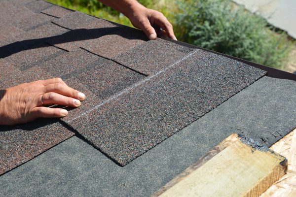 asphalt shingles installation roofer contractor installing asphalt shingles on house roofing construction