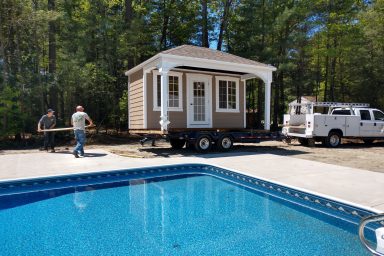 delivering pool house to dream backyard